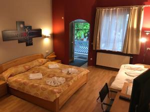 Postel nebo postele na pokoji v ubytování Hotel Korfu