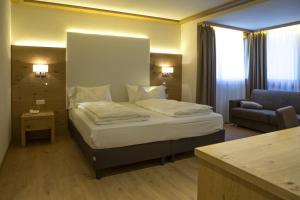 Ένα ή περισσότερα κρεβάτια σε δωμάτιο στο Hotel Collini