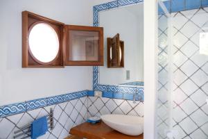 a bathroom with a sink and a mirror at La Casa del Pescatore in Filicudi