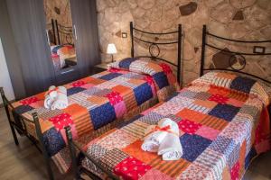 Postel nebo postele na pokoji v ubytování Rocca Pinta Guest House