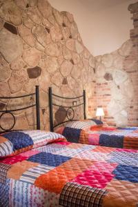 Postel nebo postele na pokoji v ubytování Rocca Pinta Guest House