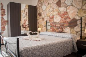 Postel nebo postele na pokoji v ubytování Rocca Pinta Guest House