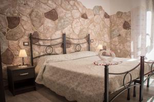 Postel nebo postele na pokoji v ubytování Rocca Pinta Guest House