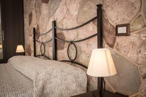 Postel nebo postele na pokoji v ubytování Rocca Pinta Guest House