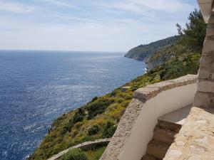a view of the ocean from a wall at Villa Bocca del Pozzo in Gagliano del Capo