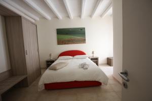 Posteľ alebo postele v izbe v ubytovaní B&B Casa Rubis