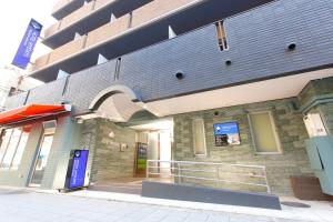 a facade of a building with a sign on it at HOTEL MYSTAYS Otemae in Osaka