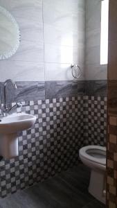 a bathroom with a sink and a toilet at Khayatz Apartment in Cairo +9 photos