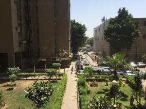 a view of a city street with cars at Khayatz Apartment in Cairo