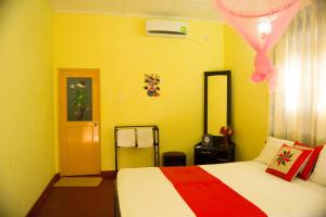 Letto o letti in una camera di Sigiri Sithru Home Stay