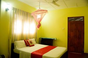 Letto o letti in una camera di Sigiri Sithru Home Stay