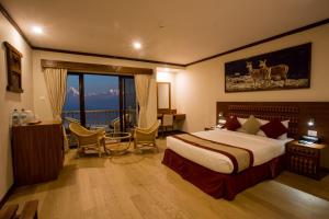 Giường trong phòng chung tại Rupakot Resort