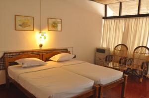 En eller flere senge i et værelse på Bangaram Island Beach Resort