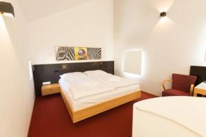 Posteľ alebo postele v izbe v ubytovaní Hotel Purkmistr