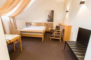 Posteľ alebo postele v izbe v ubytovaní Hotel Purkmistr