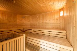 an empty sauna with wooden walls and ceilings at Hotel Antholzerhof in Anterselva di Mezzo +60 photos