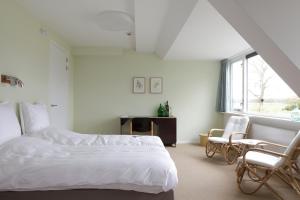 Llit o llits en una habitació de Landhuis Hotel Rikus