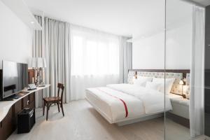 Giường trong phòng chung tại Ruby Lissi Hotel Vienna