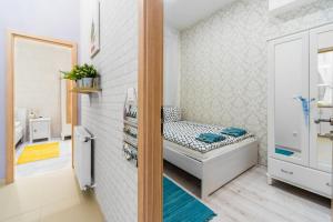 Posteľ alebo postele v izbe v ubytovaní Dominika Apartment