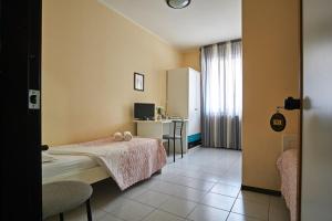 Postel nebo postele na pokoji v ubytování Hotel Mazzurco