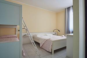 Postel nebo postele na pokoji v ubytování Hotel Mazzurco