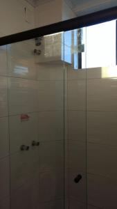 a shower with a glass door in a bathroom at Santa Clara Hotel e Restaurante in Sao Pedro do Sul