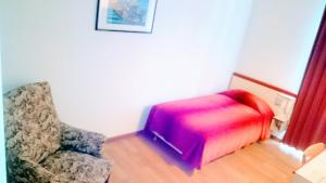 Postel nebo postele na pokoji v ubytování Hôtel Royal