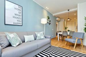 a living room with a couch and a dining room at ALTIDO Mazzini Brera in Milan