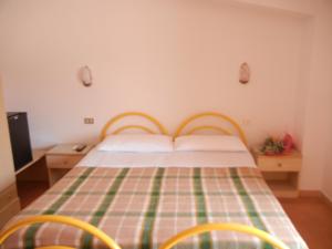 En eller flere senge i et værelse på Albergo Il Brillantino