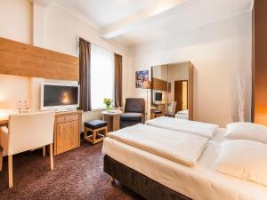 Postel nebo postele na pokoji v ubytování Hotel Jensen