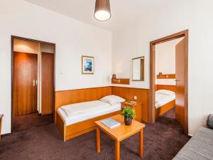 Postel nebo postele na pokoji v ubytování Hotel Jensen