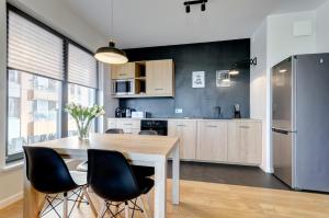 Kuchyňa alebo kuchynka v ubytovaní Apartments Brabank Old Town & by Noclegi Renters