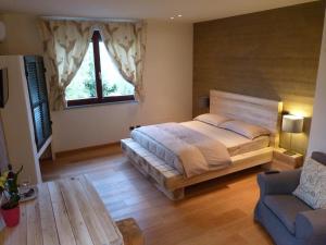 Ένα ή περισσότερα κρεβάτια σε δωμάτιο στο Ca'Luna Guest House