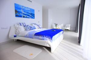 Postel nebo postele na pokoji v ubytování Villas Flamingo Resort + 29 fotografií