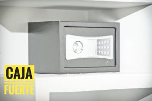 a microwave oven sitting on a shelf in a room at Le Prince Arica in Arica
