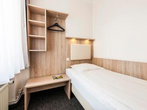Postel nebo postele na pokoji v ubytování Hotel Jensen