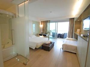 Кровать или кровати в номере Hotel Premier & Suites - Premier Resort