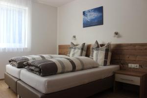 Posteľ alebo postele v izbe v ubytovaní Haus Bichali