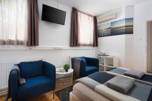 Uma TV ou centro de entretenimento em Hostel Bureau