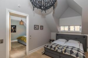 Postel nebo postele na pokoji v ubytování De Herberg Appartementen