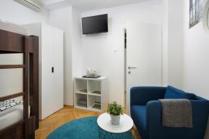 Uma TV ou centro de entretenimento em Hostel Bureau