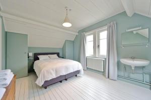 Postel nebo postele na pokoji v ubytování Vakantiehuis Strandpieper + 10 fotografií