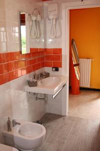 a bathroom with a sink and a mirror at B&B Viale delle Colline in Salerno