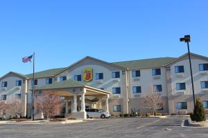 a hotel with a car parked in a parking lot at Super 8 by Wyndham South Bend in South Bend