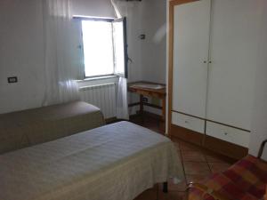 Voodi või voodid majutusasutuse Villino Iolanda toas