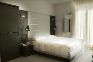 Postel nebo postele na pokoji v ubytování Hotel San Lorenzo Chiavenna