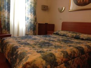 Postel nebo postele na pokoji v ubytování Hotel Tirreno