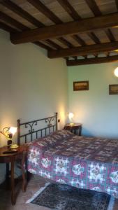 Giường trong phòng chung tại Borgo Montauto