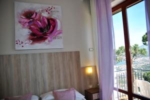Кровать или кровати в номере Hotel Villa Fiorita