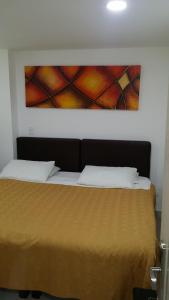 Postel nebo postele na pokoji v ubytování A Bogota On Holidays by Open - HOTEL CAS-EMBAJADA AMERICANA